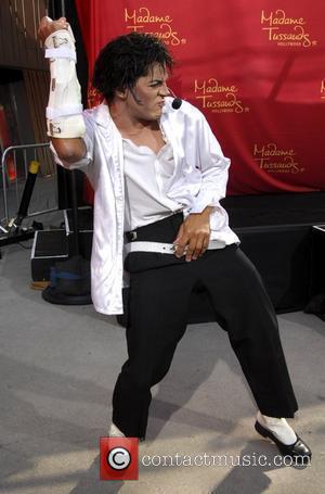 Michael Jackson impersonator Joby Rogers performs prior to the unveiling of a wax figure of Michael Jackson at Madame Tussauds...