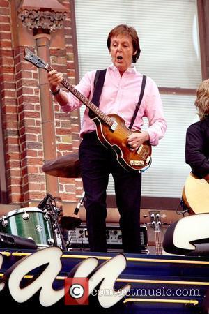 Paul McCartney performing live on the marquee of the Ed Sullivan Theater for CBS's 'Late Show with David Letterman.' McCartney...