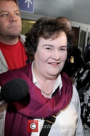 Susan Boyle  arrives at LAX airport on a British Airways flight from Heathrow and is mobbed by photographers, reporters...