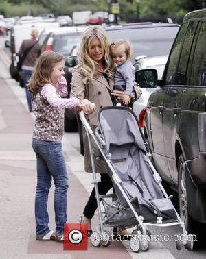 'Holby City' star Tina Hobley takes her daughters Isabella and Olivia to Regents Park London, England - 20.07.09