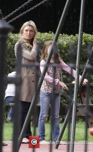 'Holby City' star Tina Hobley takes her daughter Isabella to Regents Park London, England - 20.07.09