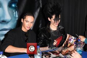 Bill Kaulitz and Tom Kaulitz Tokio Hotel sign copies of their new CD 'Humanoid' at Best Buy New York City,...