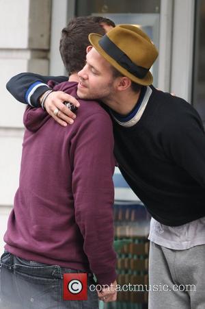 Will Young hugs with DJ Scott Mills while out for coffee with a friend London, England - 30.10.09