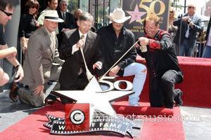 Alan Jackson and Shawn Parr  Alan Jackson is honoured with the 2405th star on the Hollywood Walk of Fame...