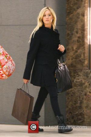 Ashley Tisdale carrying a Louis Vuitton shopping bag while out shopping with her mother Los Angeles, California - 10.12.09