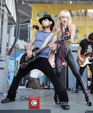 David Navarro and Matt Sorum  performs with the all-girl quartet Darling Stilettos prior to the NFL game Miami Dolphins...
