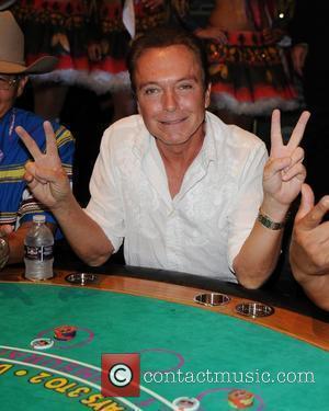 David Cassidy  former teen idol plays the first hand of Blackjack during the debut of table games at the...