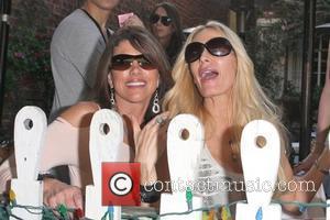 Lynne Curtin and Peggy Tanous Cast members of 'The Real Housewives of Orange County' eating lunch at The Ivy Los...