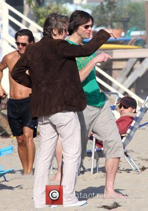 Jim Carrey with Gary Oldman on Malibu Beach Malibu, California - 04.07.10