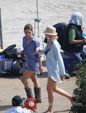 Mila Kunis and Jenna Elfman filming 'Friends with Benefits' on location at a beach Los Angeles, California - 07.09.10