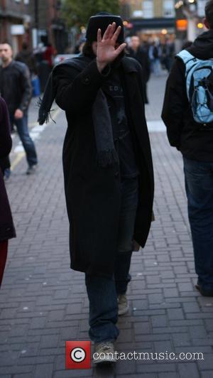 Keanu Reeves is seen shopping at Kiehl's and avoiding the paparazzi while in Covent Garden. London, England - 09.01.11