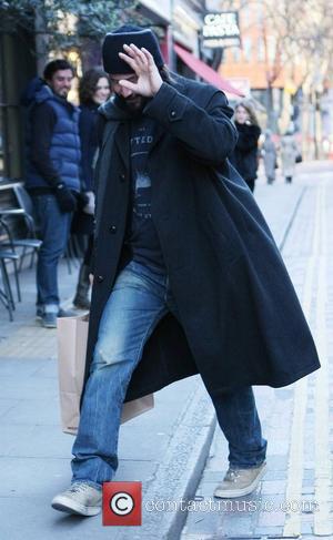 Keanu Reeves is seen shopping at Kiehl's and avoiding the paparazzi while in Covent Garden. London, England - 09.01.11