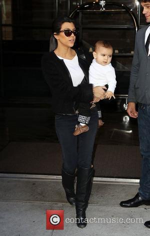 Kourtney Kardashian carrying her son Mason as she arrives at JFK Airport New York City, USA - 13.10.10