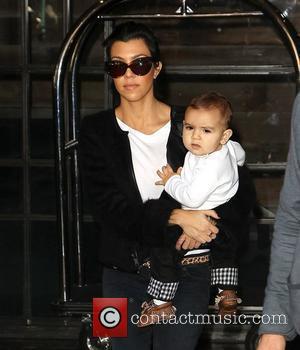 Kourtney Kardashian carrying her son Mason as she arrives at JFK Airport New York City, USA - 13.10.10