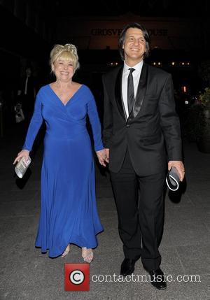 Barbara Windsor and Scott Mitchell The 2010 Laurence Olivier Awards held at the Grosvenor House Hotel - Arrivals. London, England...