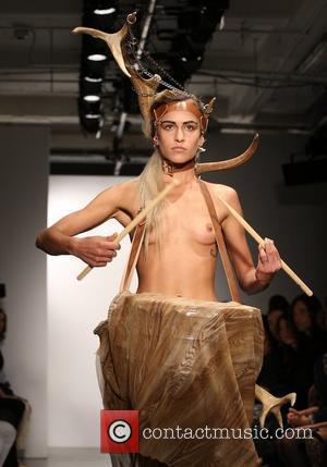 Model Alice Dellal, topless and playing a drum London Fashion Week Spring/Summer 2011 - Pam Hogg - Catwalk London, England...