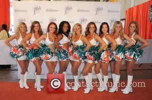 The Miami Dolphins Cheerleaders appear on the Orange Carpet prior to the Miami Dolphins vs Cleveland Browns NFL game. Miami...