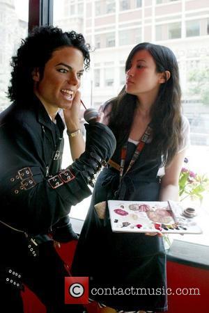 Make-up artist touches up the wax figure Madame Tussauds in Washington, D.C. installs a Michael Jackson tribute exhibit to mark...