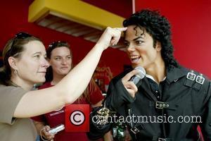 Fan touching Michael Jackson's wax figure Madame Tussauds in Washington, D.C. installs a Michael Jackson tribute exhibit to mark the...