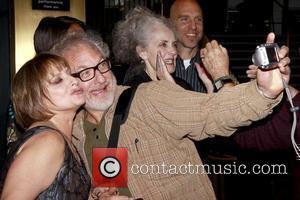 Patti LuPone and Timothy Jerome taking a photo Book Party for 'Patti LuPone: A Memoir' held at the Vivian Beaumont...