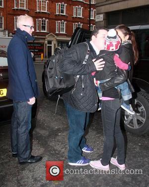 Peter Kay kisses Chris Evan's son Noah outside the BBC Radio 2 studios London, England - 10.12.10