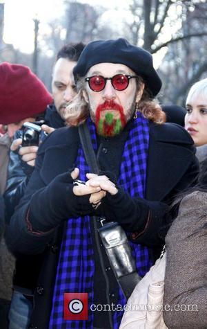 Mourners gather to sing and pay tribute at Strawberry Fields' 'Imagine' mosaic to mark the 30th Anniversary of John Lennon's...