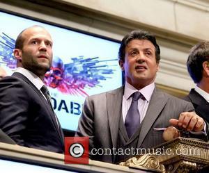 Jason Statham and Sylvester Stallone The cast of 'The Expendables' visit the New York Stock Exchange to ring the Opening...