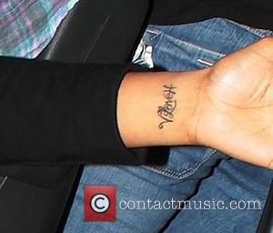 Rochelle Wiseman display's a tattoo on her wrist saying 'V Love H' The Saturdays leave 107.6 Juice FM's Style Awards...