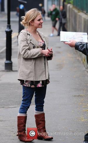 Tina O'Brien  with her daughter Scarlett and a friend enjoys an afternoon stroll.  Manchester, England - 19.04.10