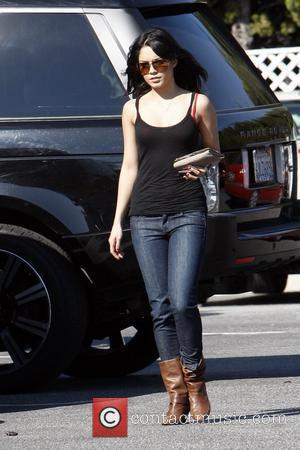 Vanessa Hudgens returning to her car after shopping, to find it has a flat tire.  Los Angeles, California -...