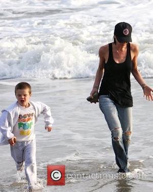 Victoria Beckham and Cruz Beckham running the beach and getting their feet wet Malibu, USA - 31.01.10