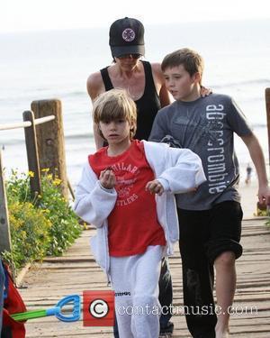 Victoria Beckham, Brooklyn Beckham and Romeo Beckham walking back from beach Malibu, USA - 31.01.10