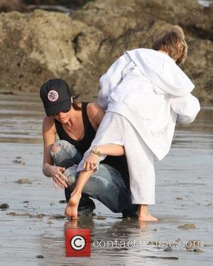 Victoria Beckham and Romeo Beckham playing on the beach Malibu, USA - 31.01.10