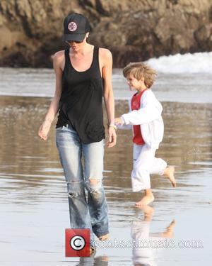 Victoria Beckham and Romeo Beckham walking on the beach Malibu, USA - 31.01.10