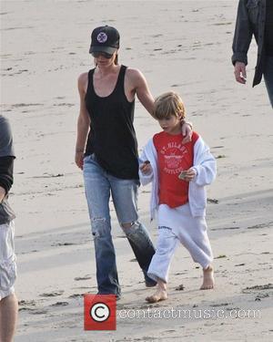 Victoria Beckham and Romeo Beckham playing walking the beach Malibu, USA - 31.01.10