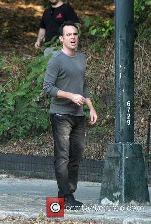 Paul Blackthorne on location filming a scene for their TV show 'White Collar' at Battery Park in Central Park New...