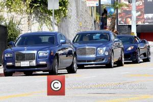 50 Cent aka Curtis James Jackson III arrives at an office building with his entourage for a meeting. Before entering...
