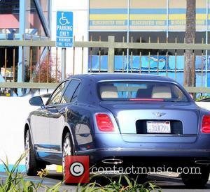 50 Cent aka Curtis James Jackson III's Bentley parked in a handicap spot, where he arrived with an entourage to...