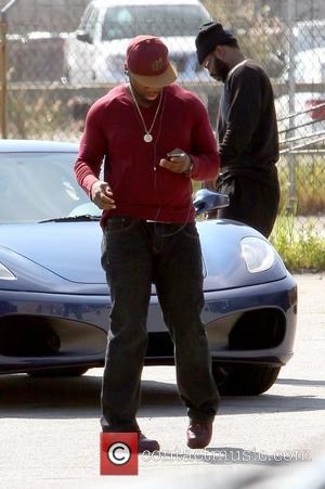 50 Cent aka Curtis James Jackson III arrives at an office building with his entourage for a meeting. Before entering...