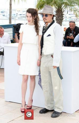 Astrid Berges-Frisbey and Johnny Depp 2011 Cannes International Film Festival - Day 4 - Pirates of the Caribbean: On Stranger...