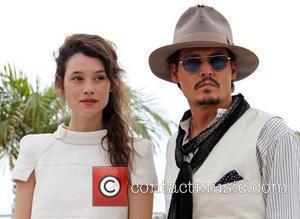 Astrid Berges-Frisbey and Johnny Depp 2011 Cannes International Film Festival - Day 4 - Pirates of the Caribbean: On Stranger...