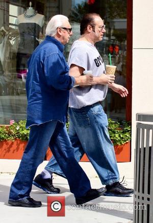 Andrew Dice Clay enjoys a Starbucks coffee and a walk through Beverly Hills with a friend Los Angeles, California -...