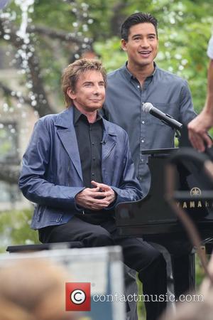 Barry Manilow and Mario Lopez at The Grove for the entertainment television news programme 'Extra' Los Angeles, California - 09.06.11