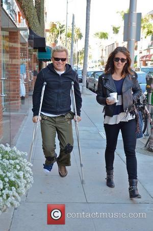 Billy Idol, real name William Broad, leaving a medical centre in Beverly Hills on crutches Los Angeles, California - 07.11.11