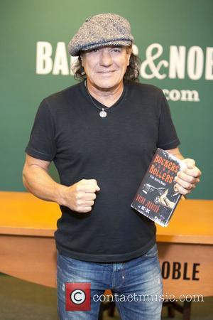 Brian Johnson of the band AC/DC  signs his new memoir 'Rockers and Rollers' at Barnes & Noble  New...