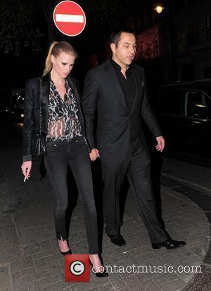 David Walliams and Lara Stone holding hands as they walk outside Nobu London, England - 19.04.11