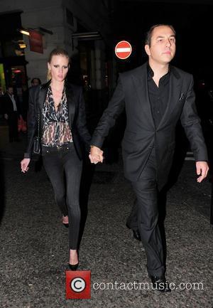 David Walliams and Lara Stone holding hands as they walk outside Nobu London, England - 19.04.11