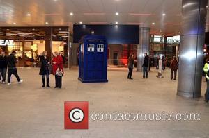 Bemused shoppers walk past the Doctor Who Tardis outside Westfield Stratford City station London, England - 21.11.11