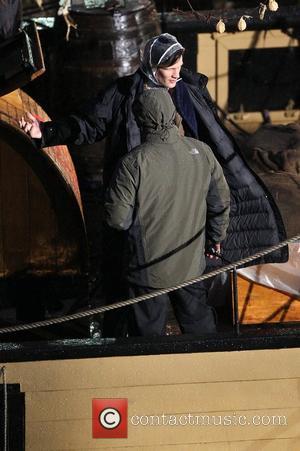 Matt Smith sporting a plastic rain bonnet on the film set of 'Dr Who' in Cornwall. Cornwall, England - 02.02.11