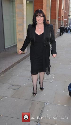Coleen Nolan smoking a cigarette  arrives for the world premiere of 'Ghost' at the Opera house Manchester, England -...